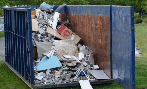 Crew sorting items at a Barnet property for recycling and reuse